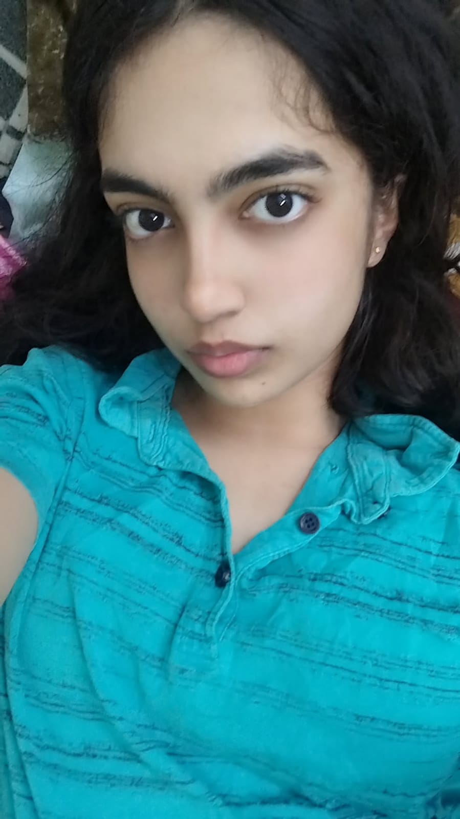 Avni in a blue shirt